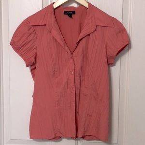 Sunset orange pleated button-down top